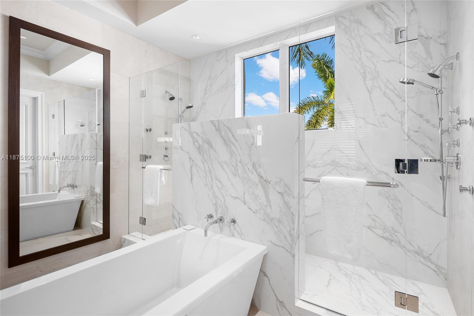 4042 Island Estates Drive Aventura, FL 33160 - Photo 20 of 46 a bathroom with a bathtub and a shower