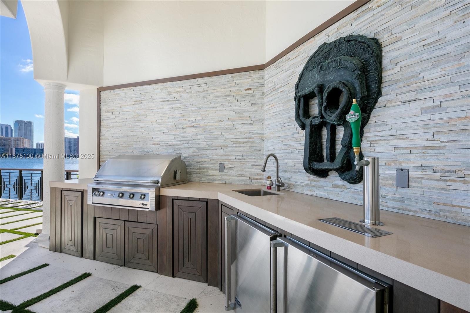 4042 Island Estates Drive Aventura, FL 33160 - Photo 22 of 46 a kitchen with a sink cabinets and stainless steel appliances