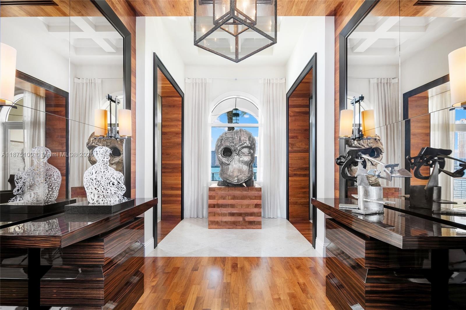 4042 Island Estates Drive Aventura, FL 33160 - Photo 23 of 46 a hallway with wooden floor and furniture