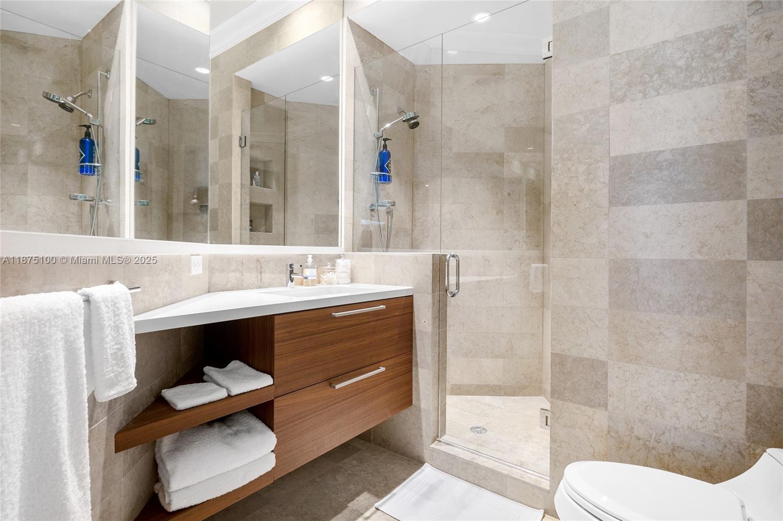 4042 Island Estates Drive Aventura, FL 33160 - Photo 25 of 46 a bathroom with a sink a toilet and shower