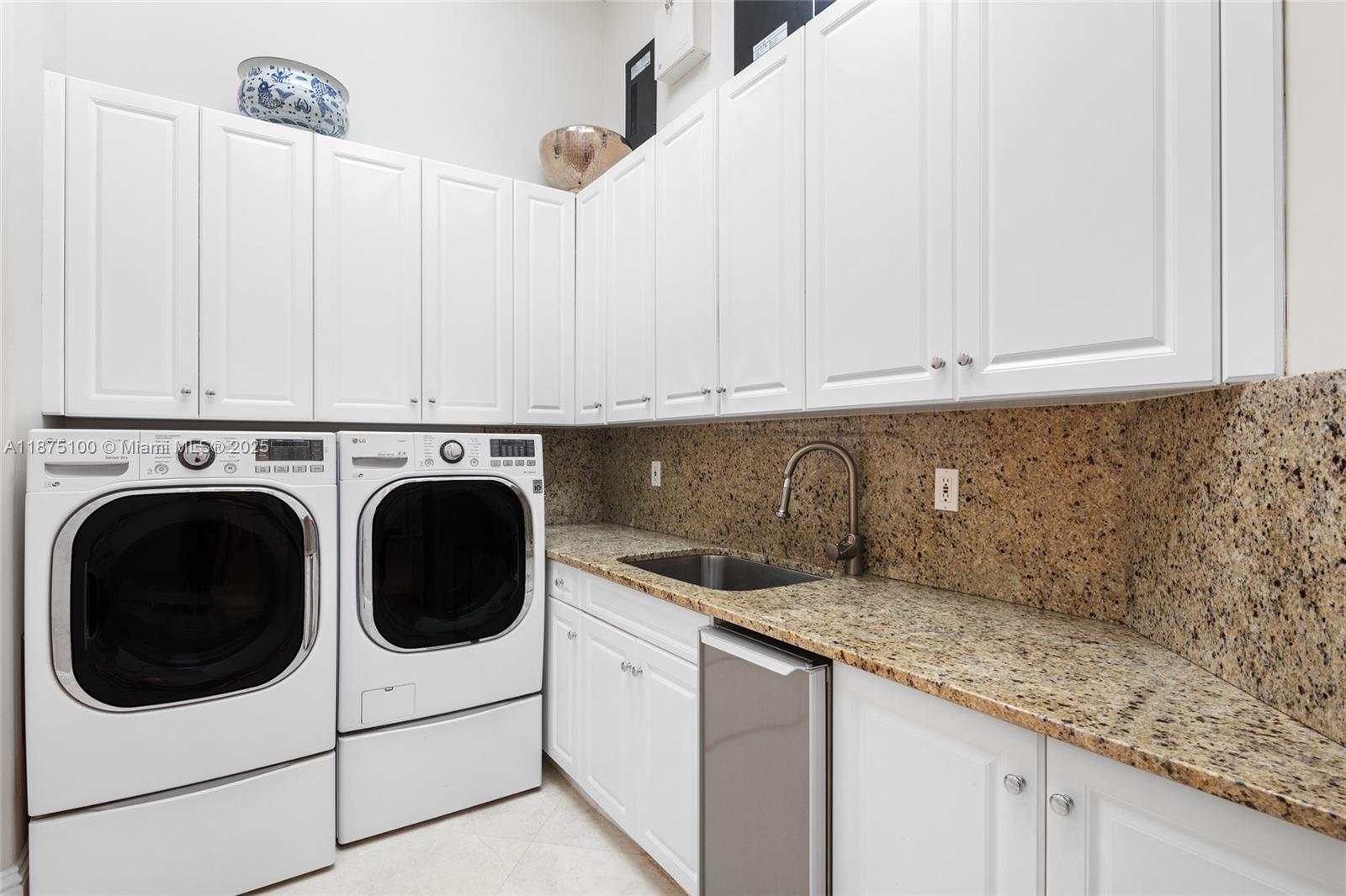 4042 Island Estates Drive Aventura, FL 33160 - Photo 30 of 46 a view of a kitchen with washer and dryer
