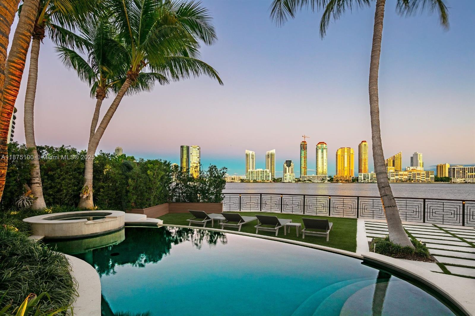 4042 Island Estates Drive Aventura, FL 33160 - Photo 44 of 46 a view of a swimming pool with a lounge chairs