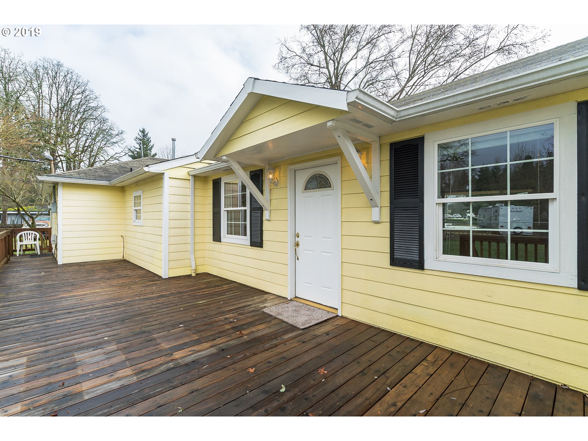 12929 Southeast Rusk Road Milwaukie, OR 97222 - Photo 3 of 32 a view of front door of house with wooden floor