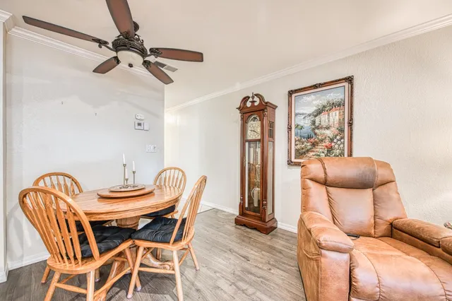 a dining room with furniture and a window