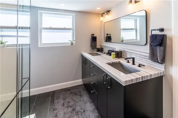 a bathroom with a sink and a mirror