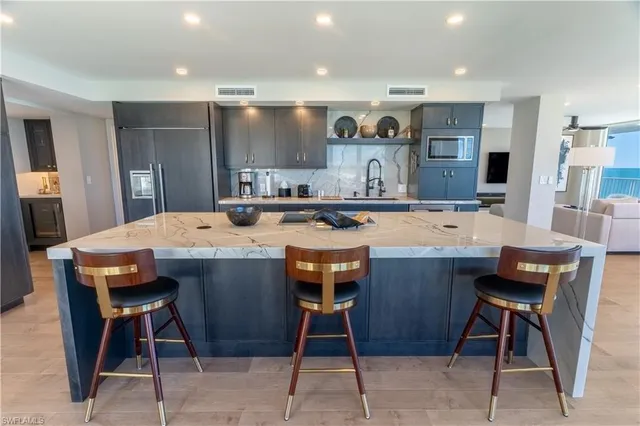 a kitchen with a table and chairs in it