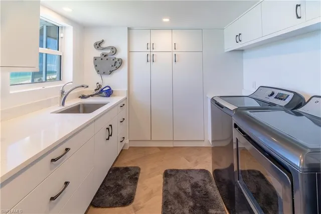 a bathroom with a sink and washing machine