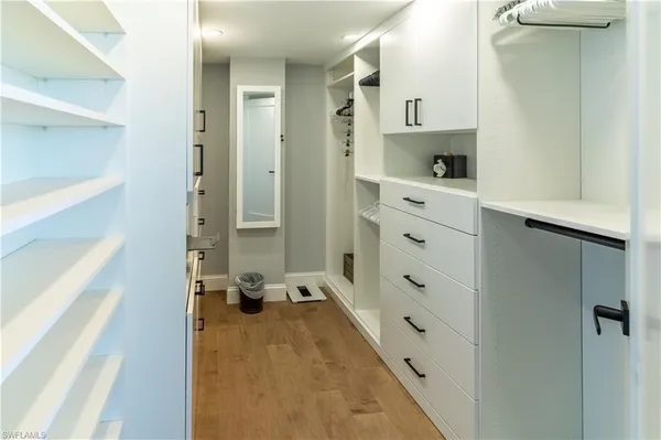 a bathroom with a double vanity sink and mirror