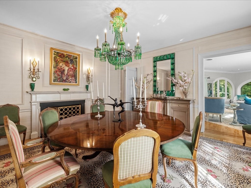 142 Crafts Road Brookline, MA 02467 - Photo 13 of 42 a view of a dining room with furniture wooden floor and chandelier