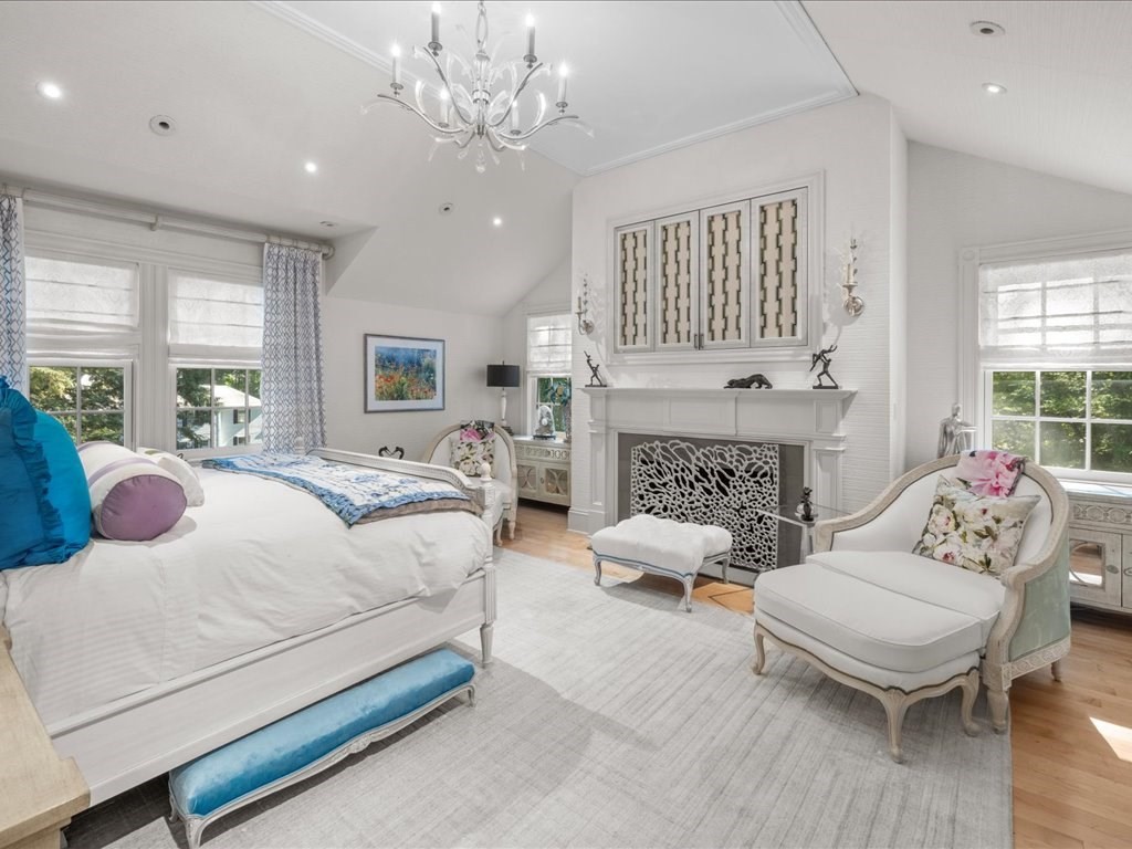 142 Crafts Road Brookline, MA 02467 - Photo 20 of 42 a bedroom with a bed wooden floor and windows