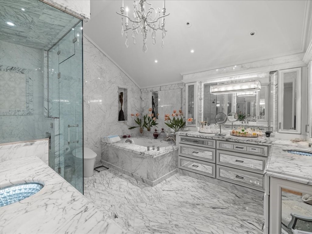 142 Crafts Road Brookline, MA 02467 - Photo 22 of 42 a bathroom with a double vanity sink toilet and shower