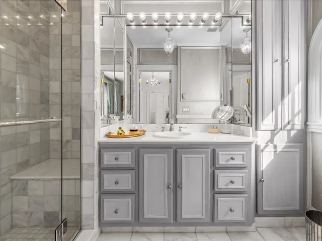 a bathroom with a double vanity sink and a mirror