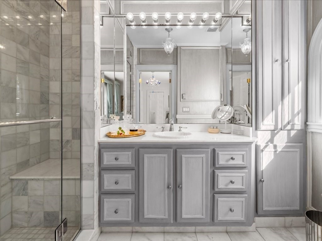 142 Crafts Road Brookline, MA 02467 - Photo 24 of 42 a bathroom with a double vanity sink and a mirror