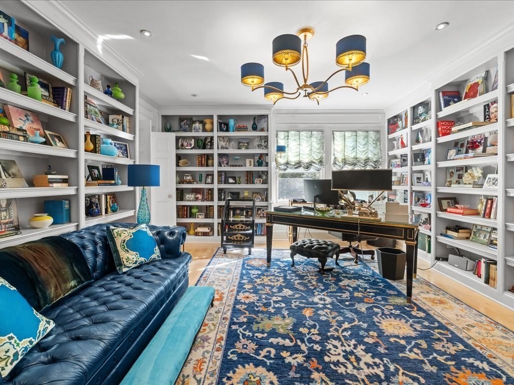 142 Crafts Road Brookline, MA 02467 - Photo 25 of 42 a living room with furniture and a book shelf