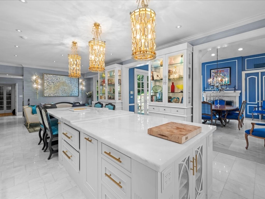 142 Crafts Road Brookline, MA 02467 - Photo 7 of 42 a kitchen with a sink a stove and chairs