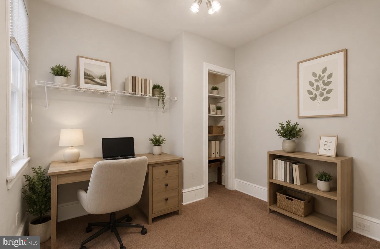 4817 Ridge Avenue Philadelphia, PA 19129 - Photo 12 of 34 a view of a workspace with furniture and a bedroom