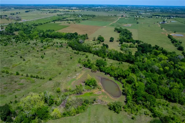 a view of a lake with a yard