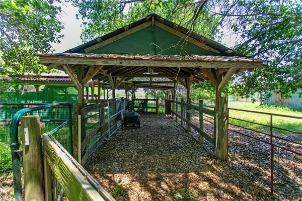 a view of a wooden deck with a trees