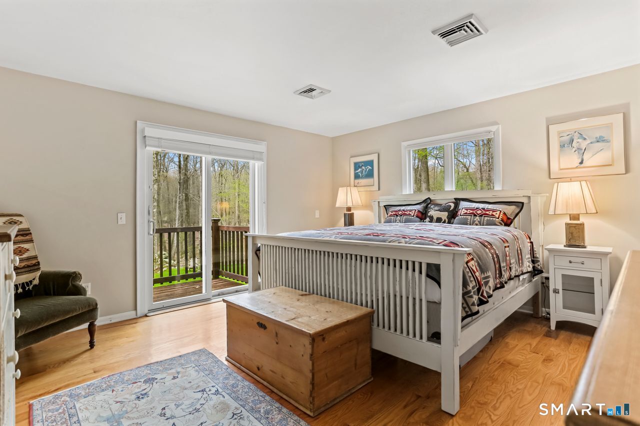 86 Seventy Acre Road Redding, CT 06896 - Photo 18 of 40 a bedroom with a bed and a couch
