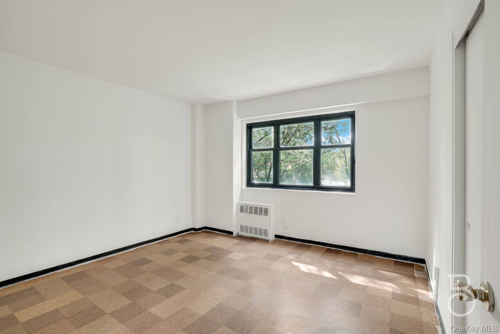 33-43 14th Street, Unit 4B Queens, NY 11106 - Photo 15 of 19 an empty room with windows