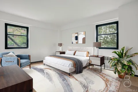 a bedroom with a bed and a couch