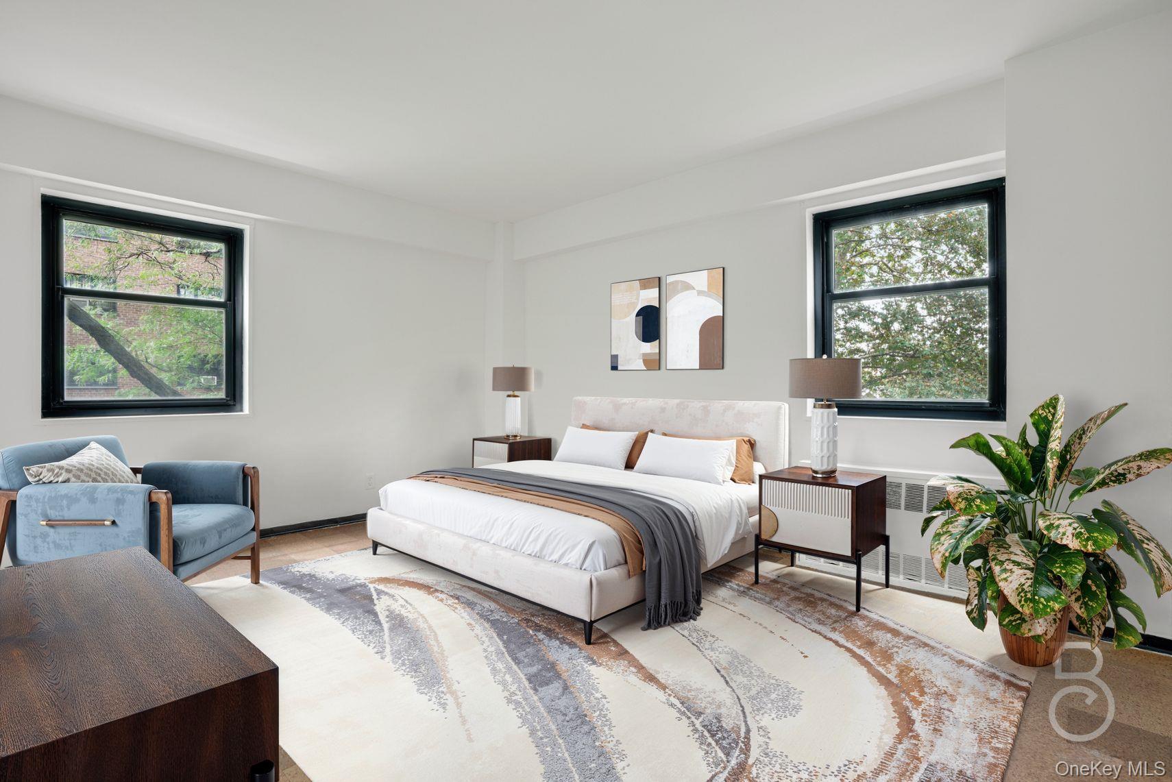 33-43 14th Street, Unit 4B Queens, NY 11106 - Photo 5 of 19 a bedroom with a bed and a couch