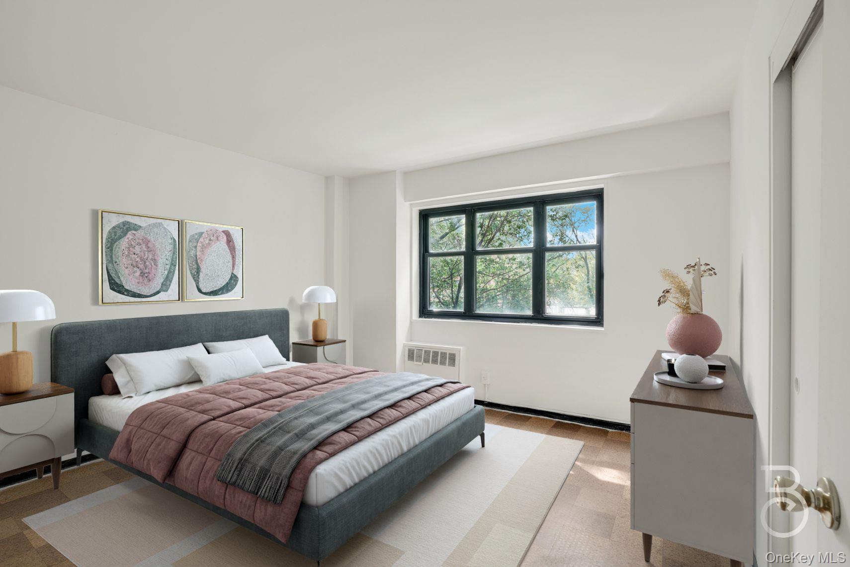 33-43 14th Street, Unit 4B Queens, NY 11106 - Photo 7 of 19 a bedroom with a bed and a window