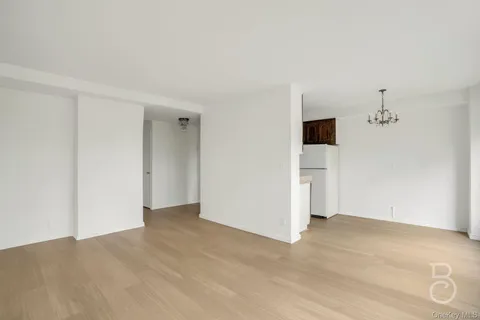 an empty room with a empty space and a hallway