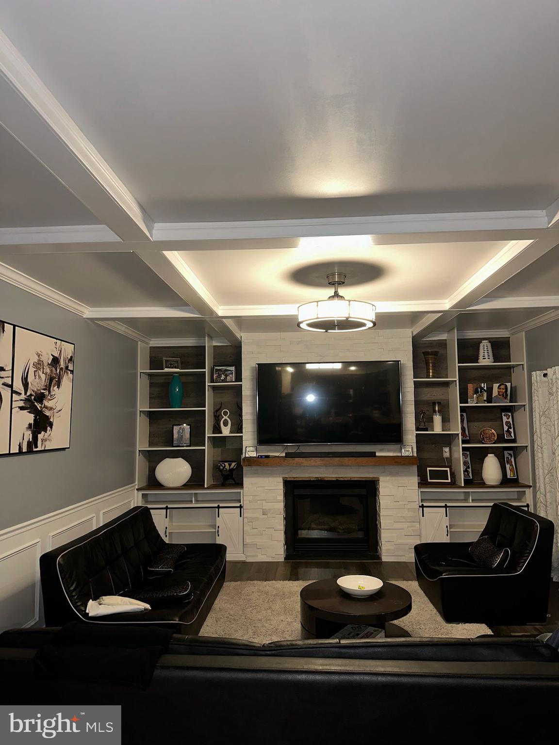 6421 Colonial Village Loop Manassas, VA 20112 - Photo 12 of 14 a living room with furniture and a flat screen tv