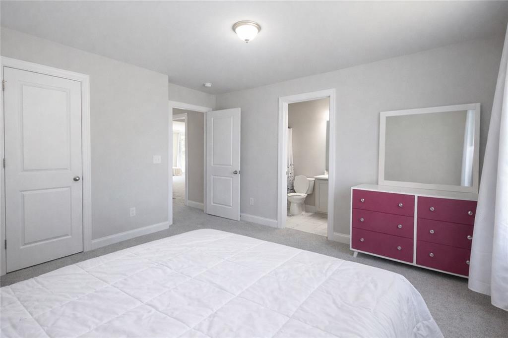 25 Hornbeam Way Covington, GA 30014 - Photo 20 of 31 a bedroom with a bed and a dresser