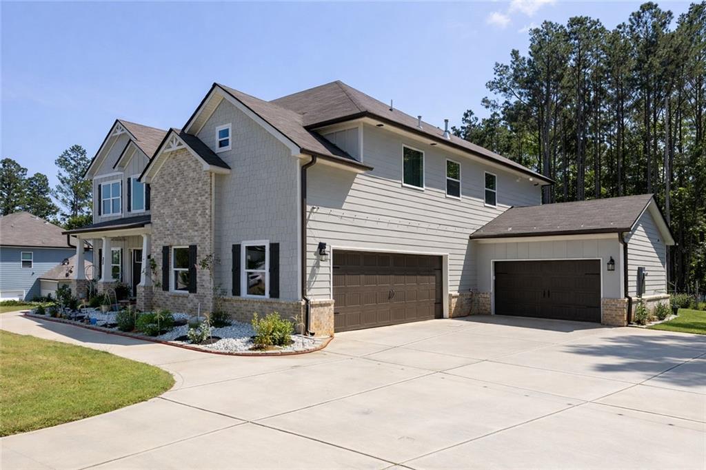 25 Hornbeam Way Covington, GA 30014 - Photo 2 of 31 a front view of a house with yard and garage