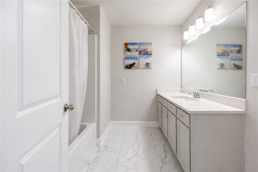 25 Hornbeam Way Covington, GA 30014 - Photo 25 of 31 a bathroom with a sink vanity granite and a mirror