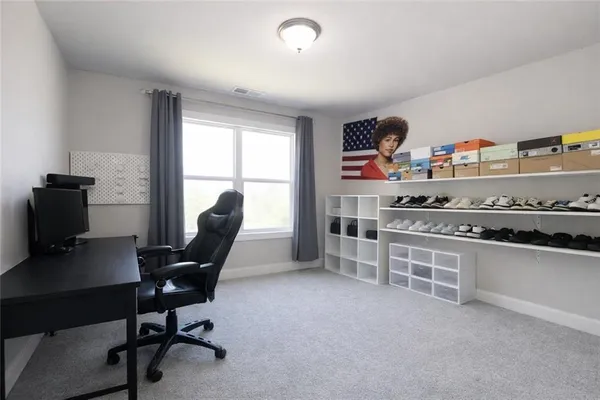 a workspace with furniture and a window