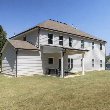 a front view of a house with garage