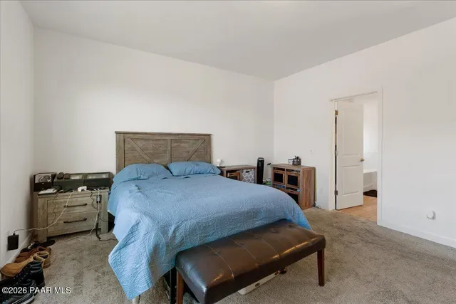a bathroom with a double vanity sink a mirror and shower