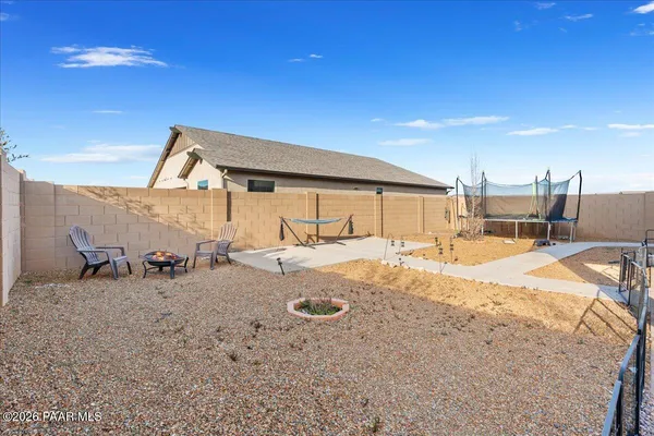 a house view with a backyard space