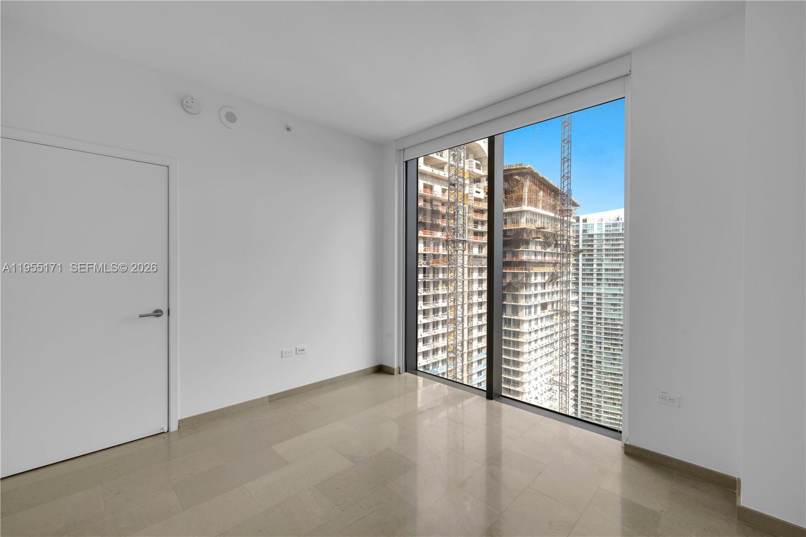 88 Southwest 7th Street, Unit 3711 Miami, FL 33130 - Photo 25 of 47 a view of an empty room with a window