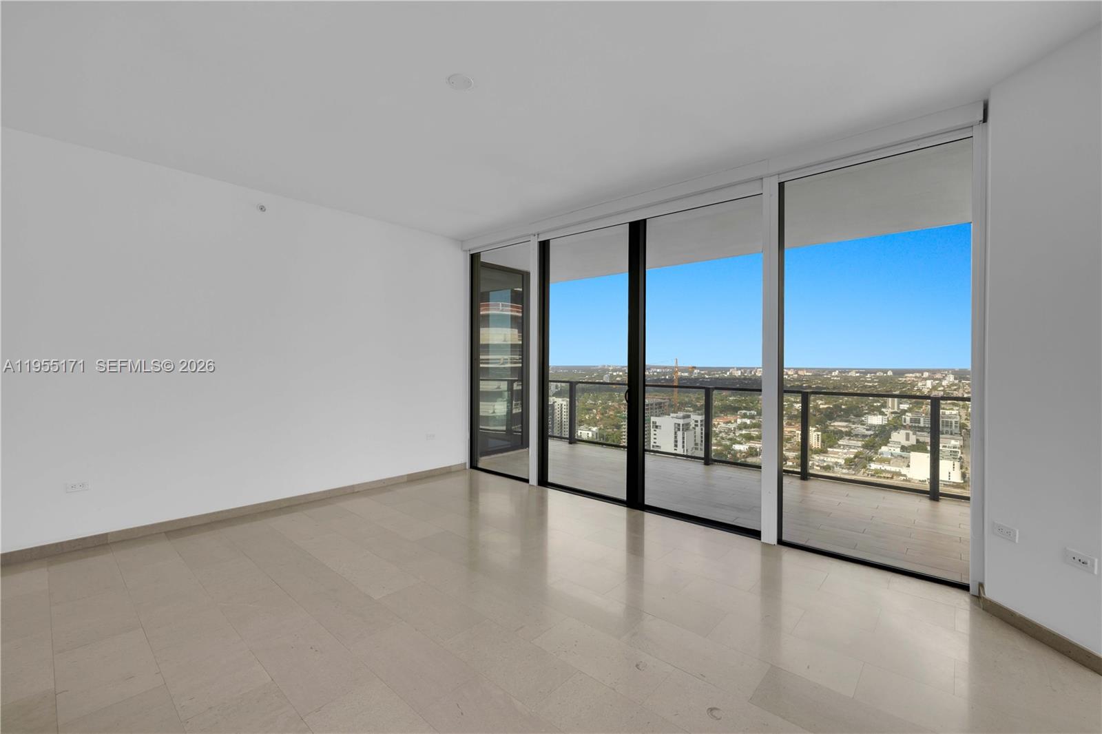 88 Southwest 7th Street, Unit 3711 Miami, FL 33130 - Photo 26 of 47 an empty room with large windows