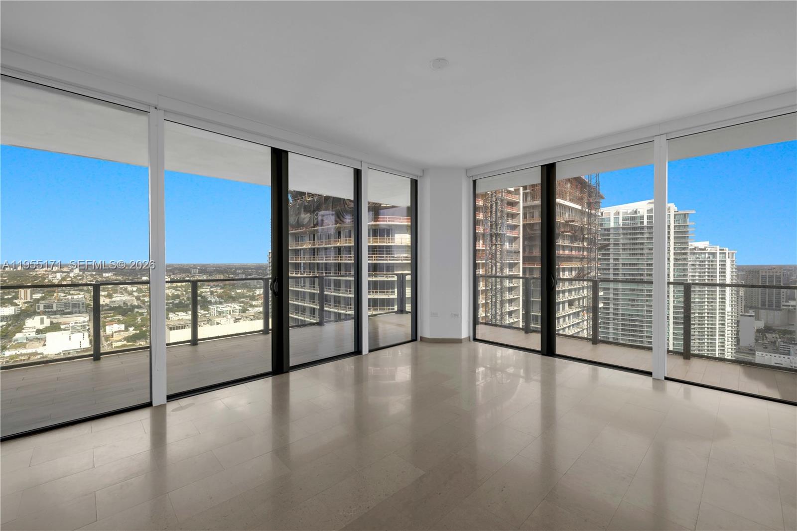88 Southwest 7th Street, Unit 3711 Miami, FL 33130 - Photo 27 of 47 wooden floor in an empty room with a window