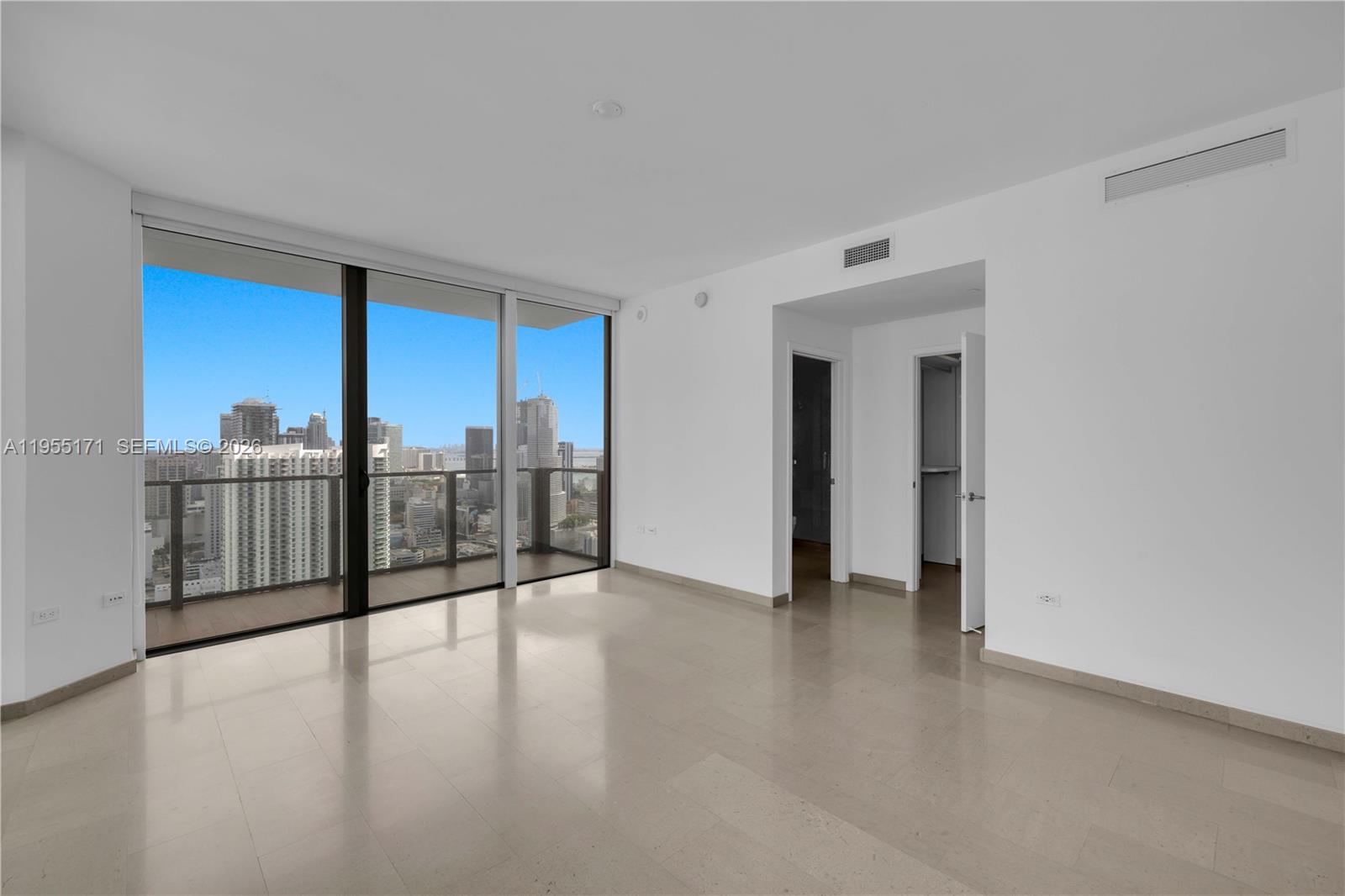 88 Southwest 7th Street, Unit 3711 Miami, FL 33130 - Photo 28 of 47 a view of a living room hardwood floor and kitchen view