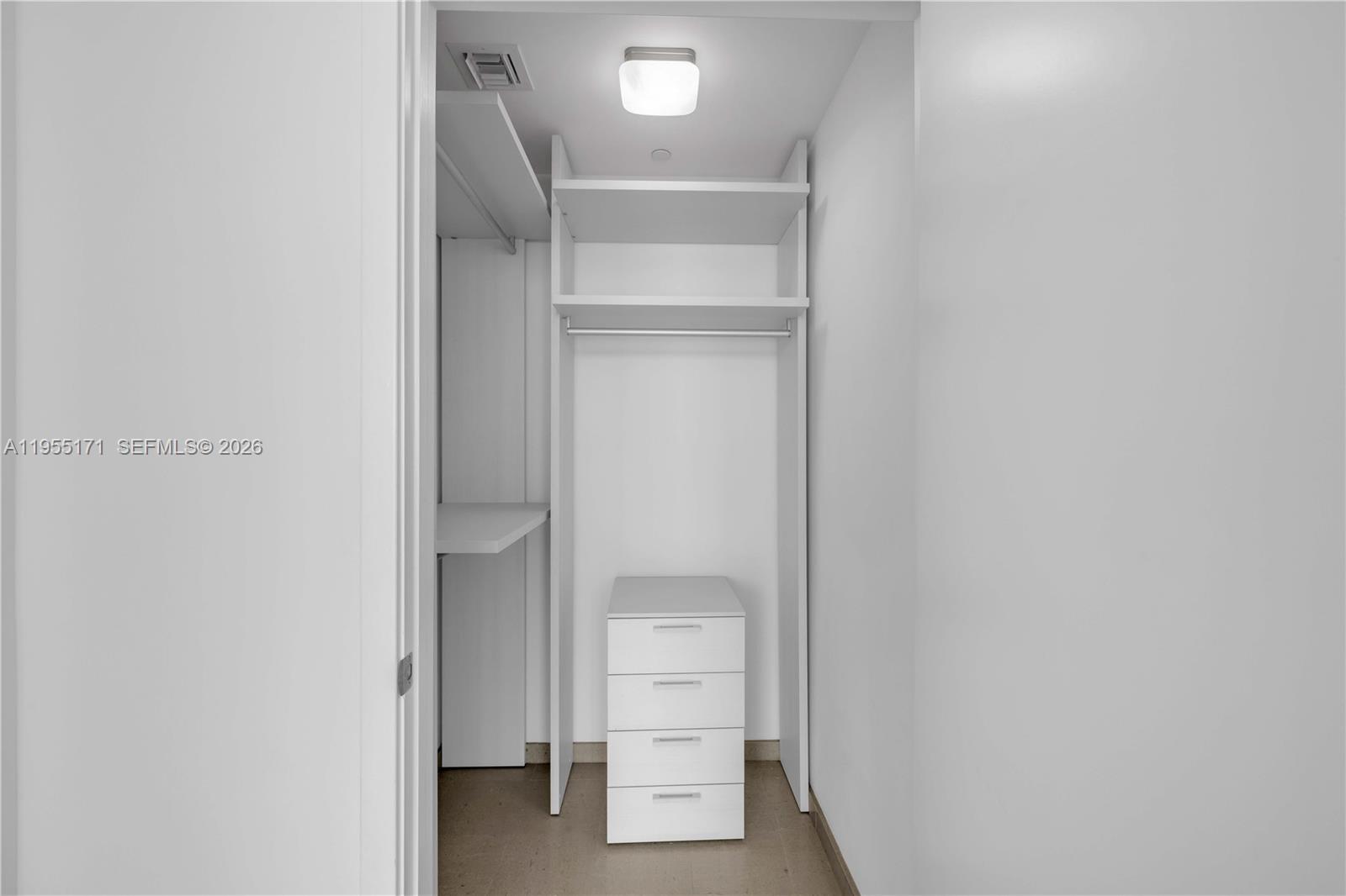 88 Southwest 7th Street, Unit 3711 Miami, FL 33130 - Photo 29 of 47 a view of an empty walk in closet