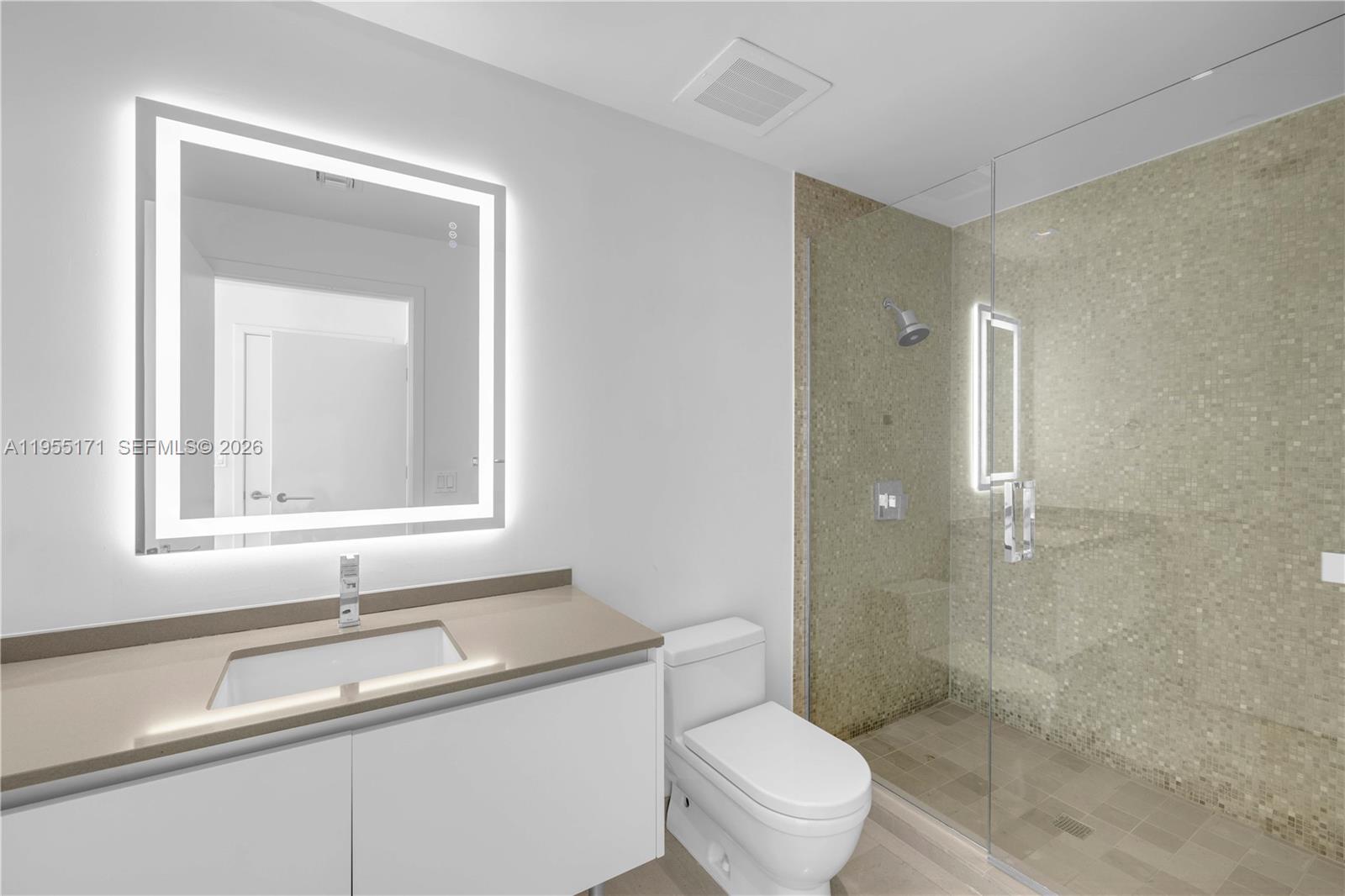 88 Southwest 7th Street, Unit 3711 Miami, FL 33130 - Photo 30 of 47 a bathroom with a sink toilet and shower