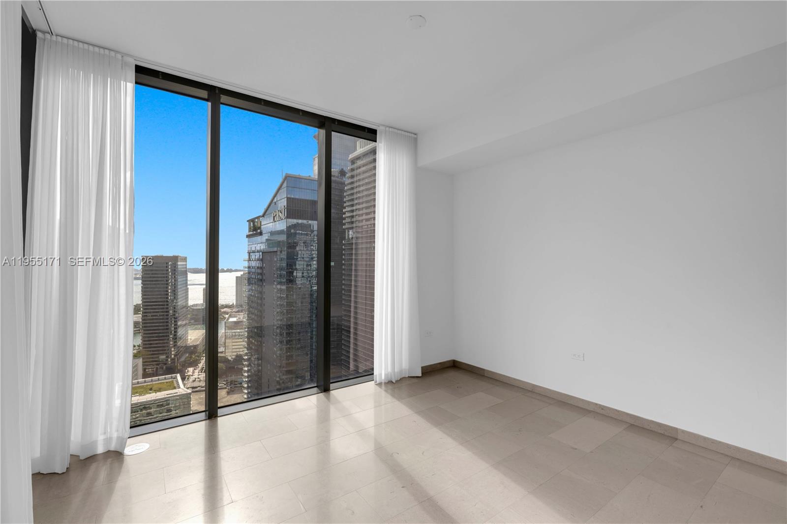 88 Southwest 7th Street, Unit 3711 Miami, FL 33130 - Photo 3 of 47 a view of an empty room and glass door