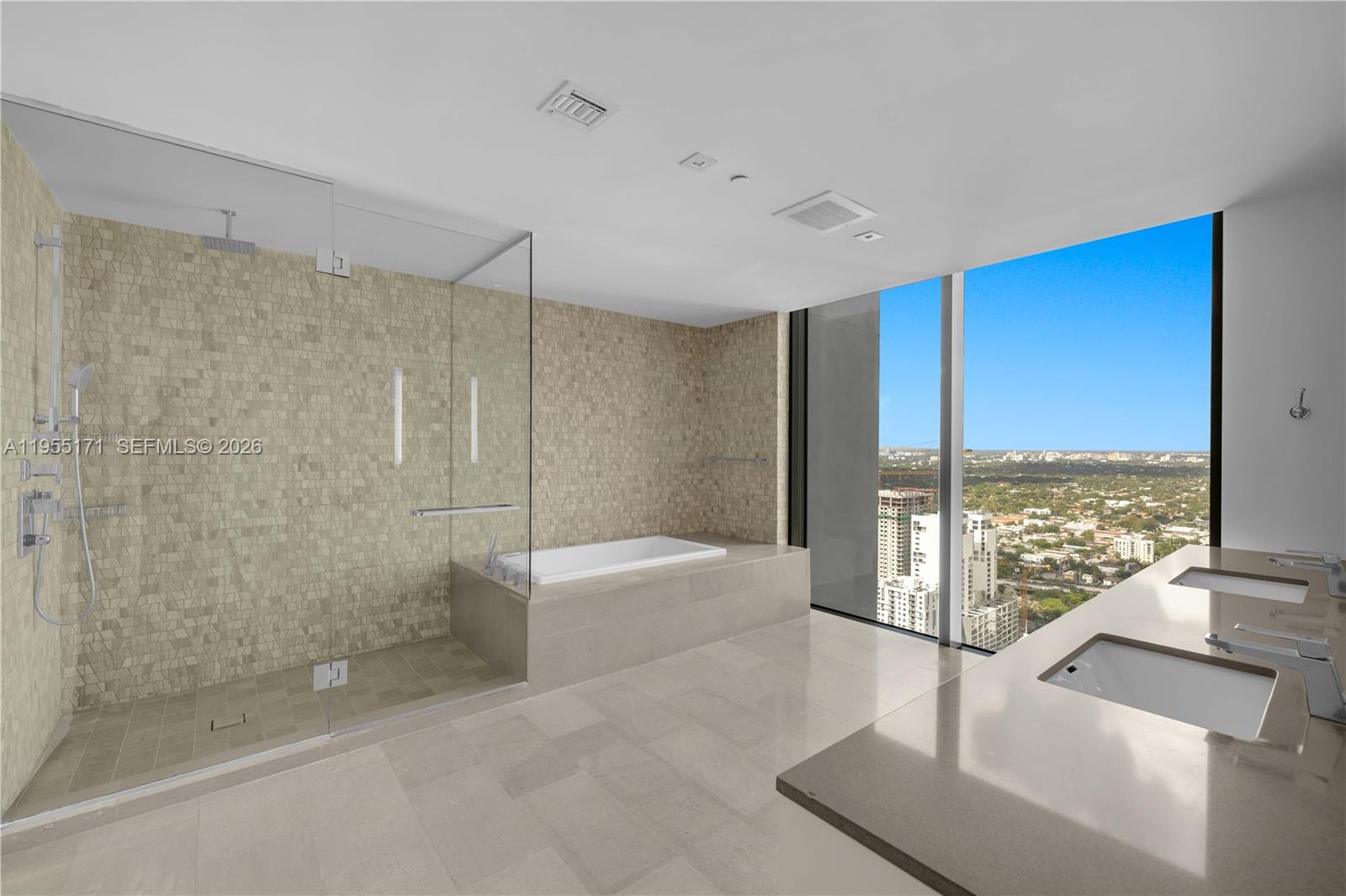88 Southwest 7th Street, Unit 3711 Miami, FL 33130 - Photo 34 of 47 a bathroom with a tub and a large window