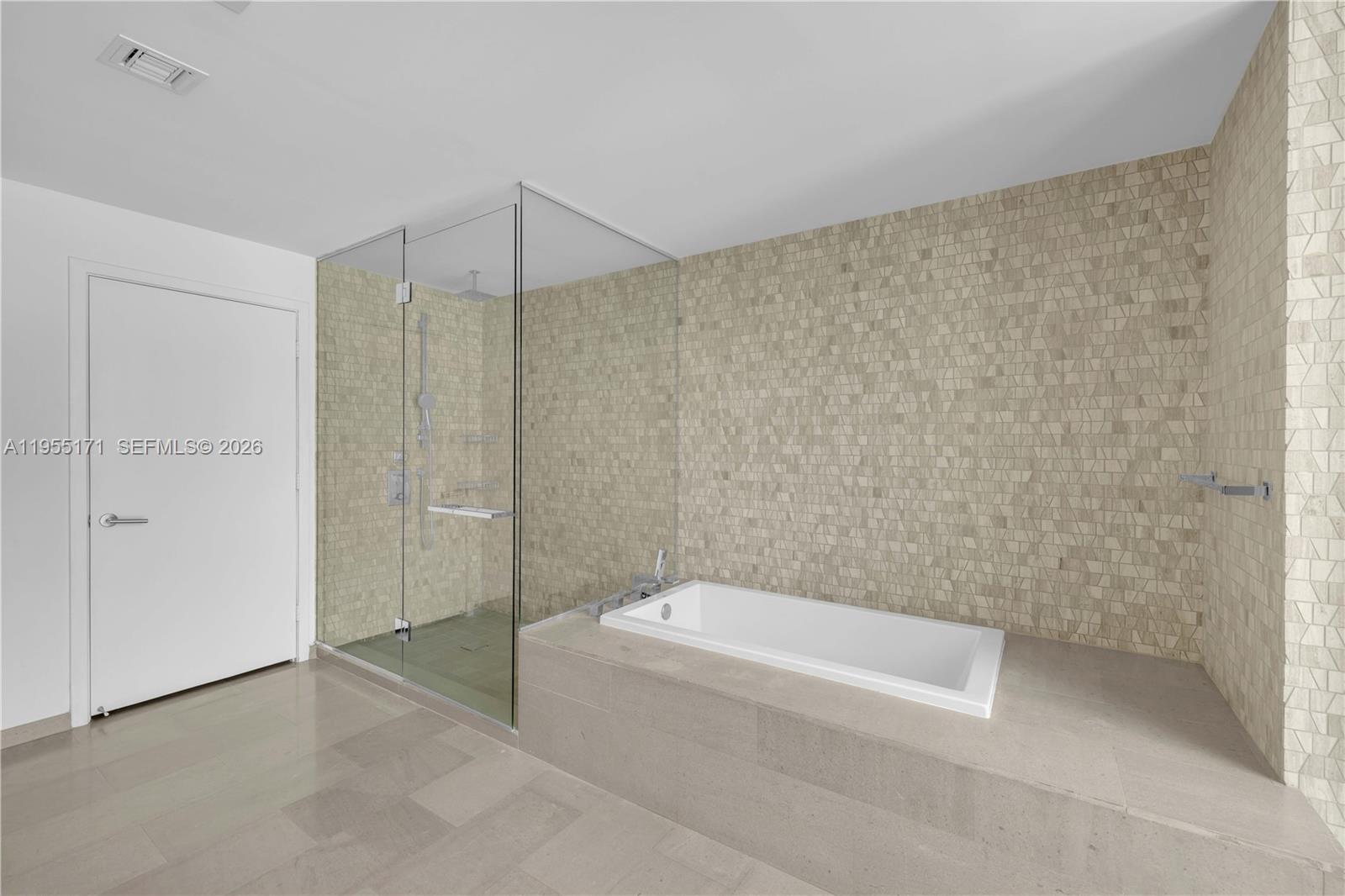 88 Southwest 7th Street, Unit 3711 Miami, FL 33130 - Photo 35 of 47 a bathroom with a shower and a bathtub