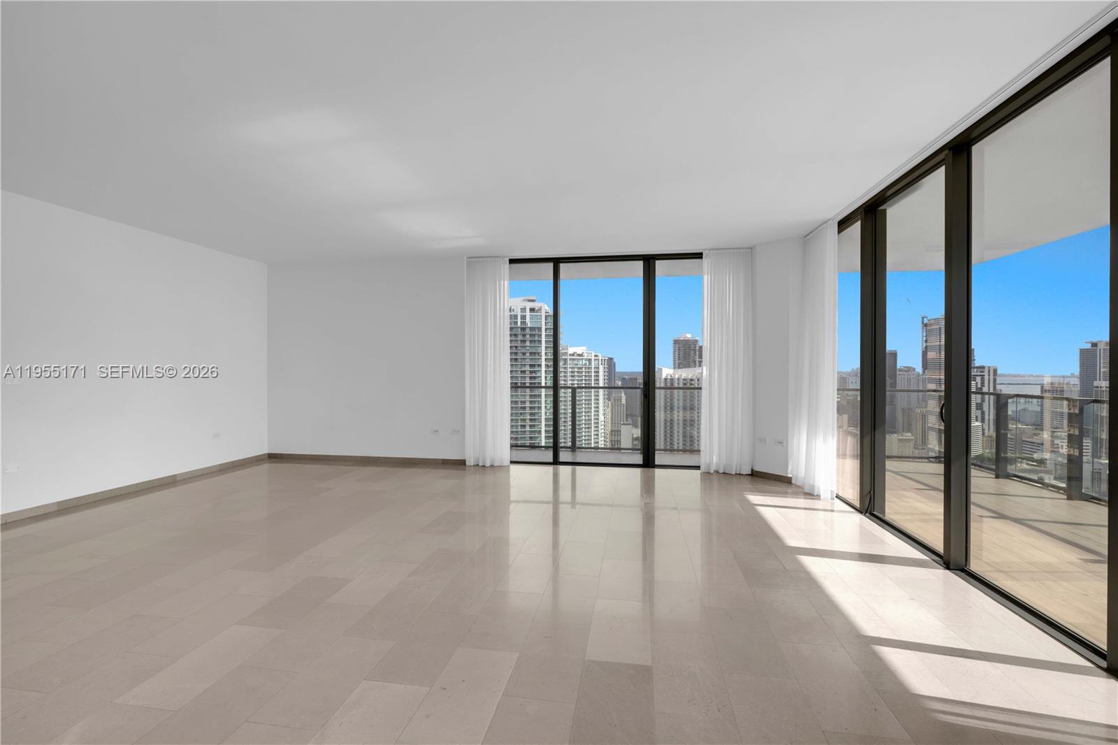 88 Southwest 7th Street, Unit 3711 Miami, FL 33130 - Photo 5 of 47 a view of an empty room and glass door