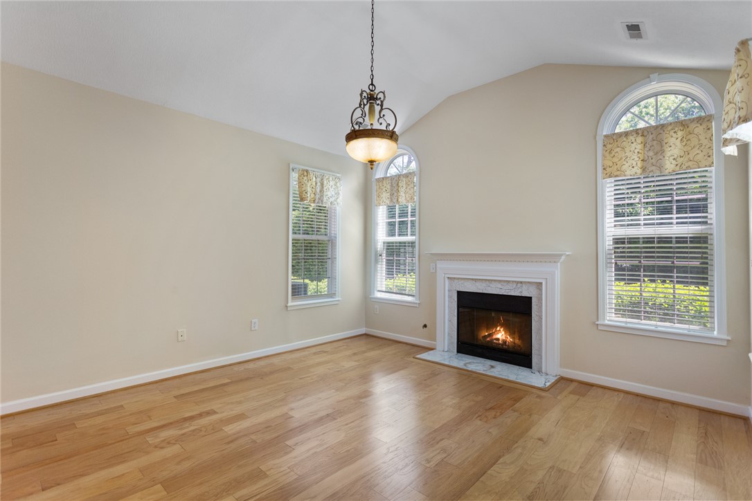 155 Life Style Lane Anderson, SC 29621 - Photo 10 of 49 This luminous living space features gleaming hardwood floors and an elegant fireplace, perfect for tranquil evenings.