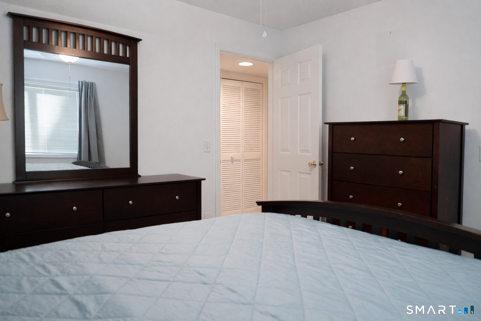 2 Mansfield Grove Road, Unit 170 East Haven, CT 06512 - Photo 16 of 27 a bedroom with a bed and a dresser