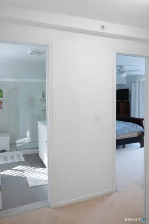 a bathroom with a toilet a sink and a shower