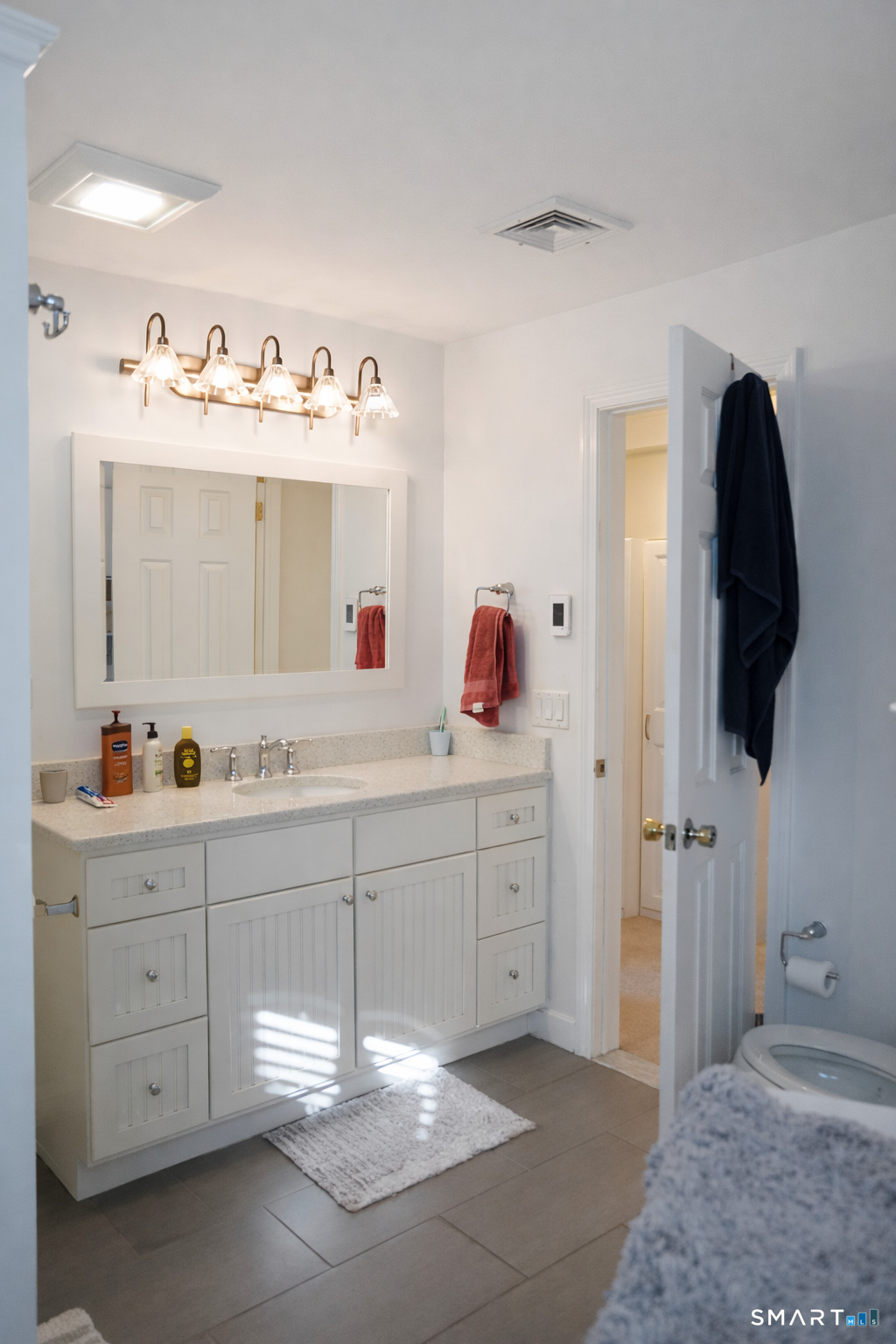 2 Mansfield Grove Road, Unit 170 East Haven, CT 06512 - Photo 19 of 27 a spacious bathroom with a double vanity sink and a mirror